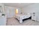 Comfortable bedroom with natural light, ensuite, dresser, and soft carpet creating a cozy atmosphere at 832 Longboat Dr, Davenport, FL 33896