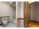Bathroom featuring a bathtub, toilet, and wood trim at 9601 Ambleside Dr, Windermere, FL 34786