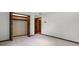 An empty bedroom includes a closet, as well as a door leading to another room at 9601 Ambleside Dr, Windermere, FL 34786