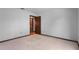An empty bedroom includes a door leading to a room with a closet at 9601 Ambleside Dr, Windermere, FL 34786