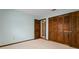 A quaint bedroom includes wall to wall carpeting and wood accents at 9601 Ambleside Dr, Windermere, FL 34786