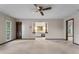 A large bedroom with an adjoining vanity and closet is carpeted at 9601 Ambleside Dr, Windermere, FL 34786