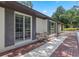 Charming outdoor patio with brick pavers and seating area, ideal for relaxing and enjoying the view at 9601 Ambleside Dr, Windermere, FL 34786