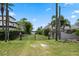 Gated property with mature landscaping and lake views provides privacy and curb appeal at 9601 Ambleside Dr, Windermere, FL 34786