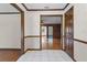 Bright hallway with tiled flooring and detailed woodwork leading to inviting living spaces in the home at 9601 Ambleside Dr, Windermere, FL 34786