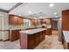 Spacious kitchen features stainless appliances, large island, and ample cabinets at 9601 Ambleside Dr, Windermere, FL 34786