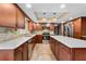 Spacious kitchen features stainless appliances, tile backsplash, and ample cabinets at 9601 Ambleside Dr, Windermere, FL 34786