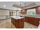 A great kitchen with stainless appliances, tile floors and center island at 9601 Ambleside Dr, Windermere, FL 34786