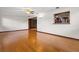 Bright living room features hardwood floors and an open view into the kitchen at 9601 Ambleside Dr, Windermere, FL 34786