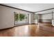 Spacious living room filled with natural light, featuring hardwood floors and a neutral color palette at 9601 Ambleside Dr, Windermere, FL 34786