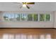 Bright living room featuring hardwood floors and natural light with views of the outdoors at 9601 Ambleside Dr, Windermere, FL 34786