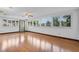 Bright living room featuring hardwood floors, natural light, and views of the outdoors at 9601 Ambleside Dr, Windermere, FL 34786