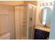 Updated bathroom with a vanity, framed mirror, glass shower stall, and ceramic flooring at 1001 Dampierre Ct, Kissimmee, FL 34759
