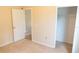 Bedroom view including two entry doors and a closet at 1001 Dampierre Ct, Kissimmee, FL 34759
