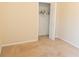 This bedroom features neutral walls, carpet flooring, and a closet for ample storage space at 1001 Dampierre Ct, Kissimmee, FL 34759