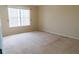 Bedroom featuring neutral walls, carpeting, and a window for natural lighting at 1001 Dampierre Ct, Kissimmee, FL 34759