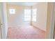 Bright bedroom with multiple windows that provide plenty of natural light and neutral walls at 1001 Dampierre Ct, Kissimmee, FL 34759