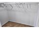Walk-in closet with multiple shelves for storage and neutral colored carpeting at 1001 Dampierre Ct, Kissimmee, FL 34759