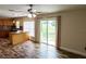 A bright dining area offers a view of the backyard and an adjacent modern kitchen at 1001 Dampierre Ct, Kissimmee, FL 34759