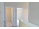 Hallway with multiple doorways leading to bedrooms or other rooms within the house at 1001 Dampierre Ct, Kissimmee, FL 34759