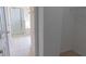 Hallway leads to bathroom with glass shower, soaking tub, and an open closet to the right at 1001 Dampierre Ct, Kissimmee, FL 34759