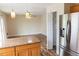 Bright kitchen and dining area with stainless steel appliances and modern countertops at 1001 Dampierre Ct, Kissimmee, FL 34759
