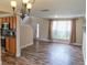 Open floor plan featuring wood-look flooring, natural light, and updated features at 1001 Dampierre Ct, Kissimmee, FL 34759