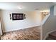 Spacious living room with wood-look floors and modern fixtures, perfect for entertaining at 1001 Dampierre Ct, Kissimmee, FL 34759