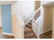 Carpeted staircase with white railings, leading to the upper level of the home at 1001 Dampierre Ct, Kissimmee, FL 34759