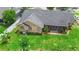 Aerial view of the home shows the house, fenced in backyard and surrounding greenery at 1003 Jackson Creek Ct, Oviedo, FL 32765