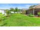A large, well-maintained backyard with lush green grass and a white fence at 1003 Jackson Creek Ct, Oviedo, FL 32765