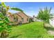 An expansive backyard featuring lush grass and well-maintained landscaping at 1003 Jackson Creek Ct, Oviedo, FL 32765