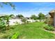 A lush backyard with green grass and well manicured shrubbery at 1003 Jackson Creek Ct, Oviedo, FL 32765