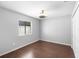 Bedroom featuring wood floors, a closet, a window, and a ceiling fan at 1003 Jackson Creek Ct, Oviedo, FL 32765