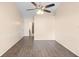 Spacious bedroom with hardwood flooring, decorative chair rail, and neutral wall color at 1003 Jackson Creek Ct, Oviedo, FL 32765