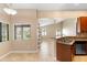 Dining area with views to another room and out to the backyard from two large windows at 1003 Jackson Creek Ct, Oviedo, FL 32765