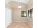 Bright dining room with a modern lighting fixture and tiled flooring adjacent to a closet and a window at 1003 Jackson Creek Ct, Oviedo, FL 32765