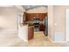 Modern kitchen with stainless steel appliances, wooden cabinetry, and granite countertops on tiled floors at 1003 Jackson Creek Ct, Oviedo, FL 32765