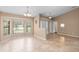 Open-concept space with neutral walls, tile flooring, and large bay windows for natural light at 1003 Jackson Creek Ct, Oviedo, FL 32765