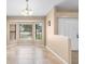 Sunlit living room featuring tile flooring, neutral walls, and a bay window at 1003 Jackson Creek Ct, Oviedo, FL 32765