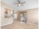 Spacious living room with breakfast bar to the kitchen and sliding glass door access to patio at 1003 Jackson Creek Ct, Oviedo, FL 32765