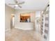 Open-concept living room with breakfast bar connecting to the kitchen with recessed lighting and neutral colored walls at 1003 Jackson Creek Ct, Oviedo, FL 32765