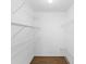 Walk-in closet featuring a wood floor and wire shelving at 1003 Jackson Creek Ct, Oviedo, FL 32765