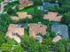 Aerial image features homes with pools and lush landscaping in a well-established residential community at 11015 Hawkshead Ct, Windermere, FL 34786