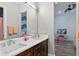 Elegant bathroom with a double sink vanity, modern fixtures, and neutral color palette at 11015 Hawkshead Ct, Windermere, FL 34786