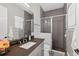 Modern bathroom featuring a glass shower, contemporary fixtures, and sleek dark vanity at 11015 Hawkshead Ct, Windermere, FL 34786