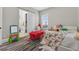 Playful bedroom with a play table, and a large window for natural light at 11015 Hawkshead Ct, Windermere, FL 34786