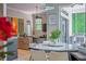 Open-concept breakfast nook with views to backyard, modern lighting, and tile flooring at 11015 Hawkshead Ct, Windermere, FL 34786
