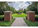 Entrance to Carmel Gardens featuring manicured grounds and a fountain as a focal point at 11015 Hawkshead Ct, Windermere, FL 34786