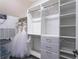 Walk-in closet with built-in shelving and hanging racks for optimal storage and organization at 11015 Hawkshead Ct, Windermere, FL 34786